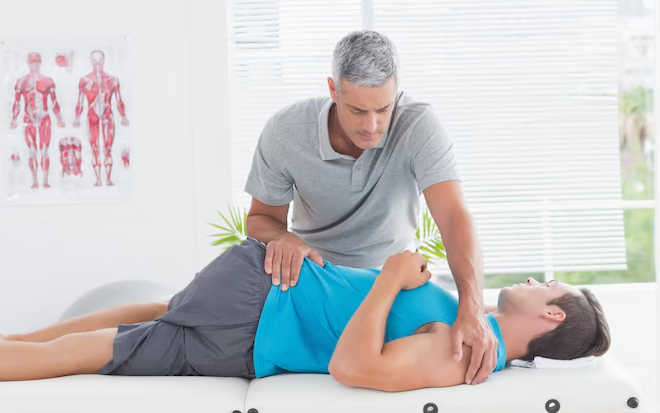 Chiropractor treating patient after car accident injury