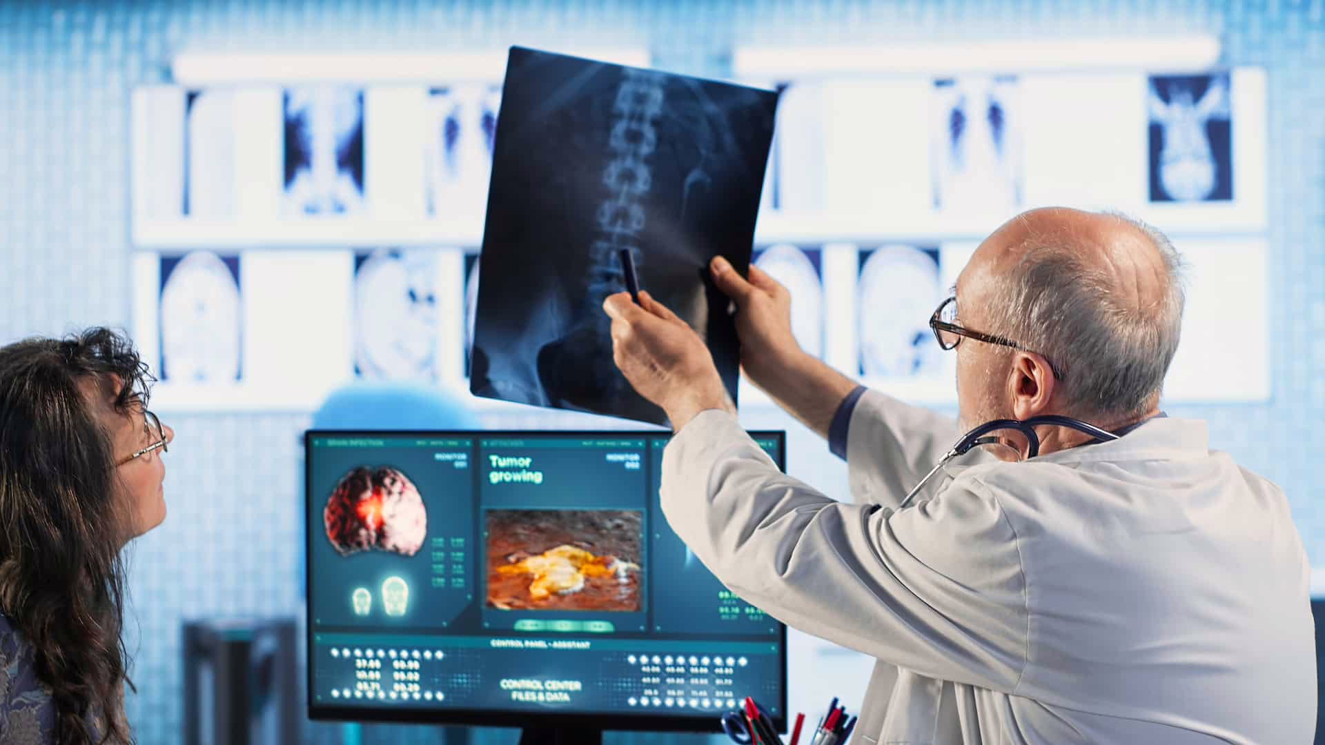 Medical professional reviewing diagnostic imaging results