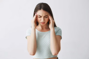 woman feeling dizzy while holding her head