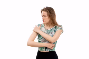 Person experiencing arm pain and numbness from carpal tunnel symptoms