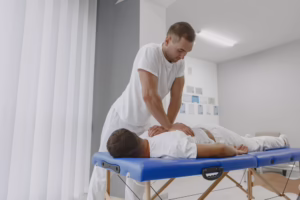 Patient receiving chiropractic care after surgery for recovery support