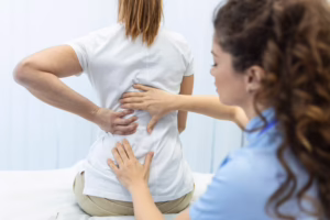 Person experiencing lower back pain from spinal stenosis
