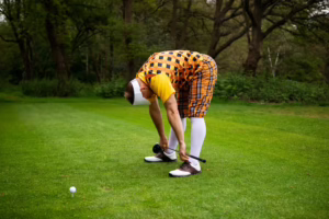 Golfer stretching on course to improve mobility and help prevent sports injuries