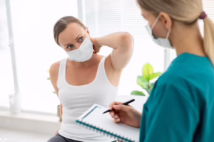 Doctor treating patient for neck pain to reduce stiffness and improve mobility